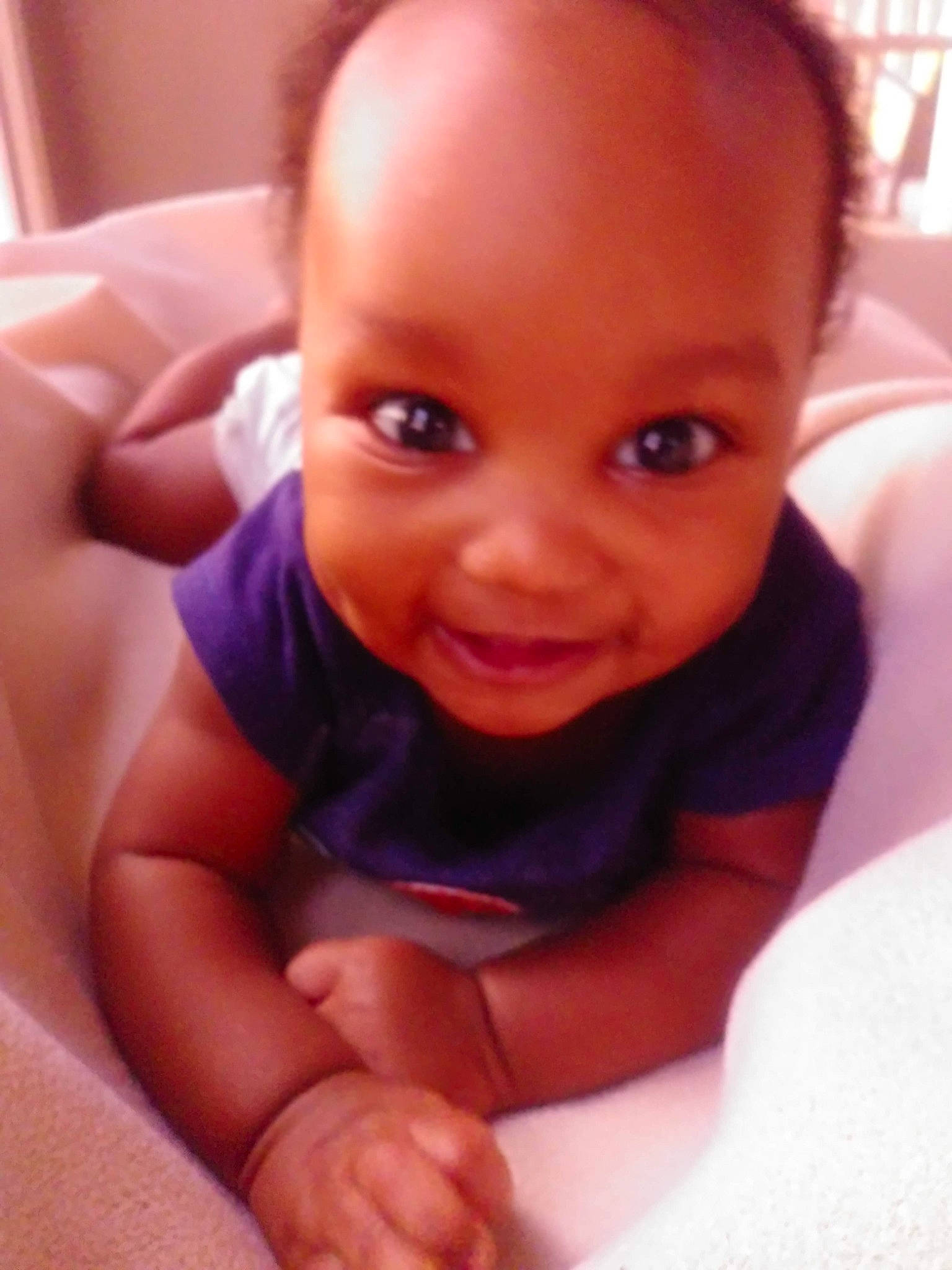 Damarion is registered to the contest to win money with this photo: baby, baby_toddler_clothing, cheek, child, chin, comfort, eyebrow, facial_expression, finger, forehead, iris, laugh, lip, mouth, muscle, organ, person, skin, thumb, toddler