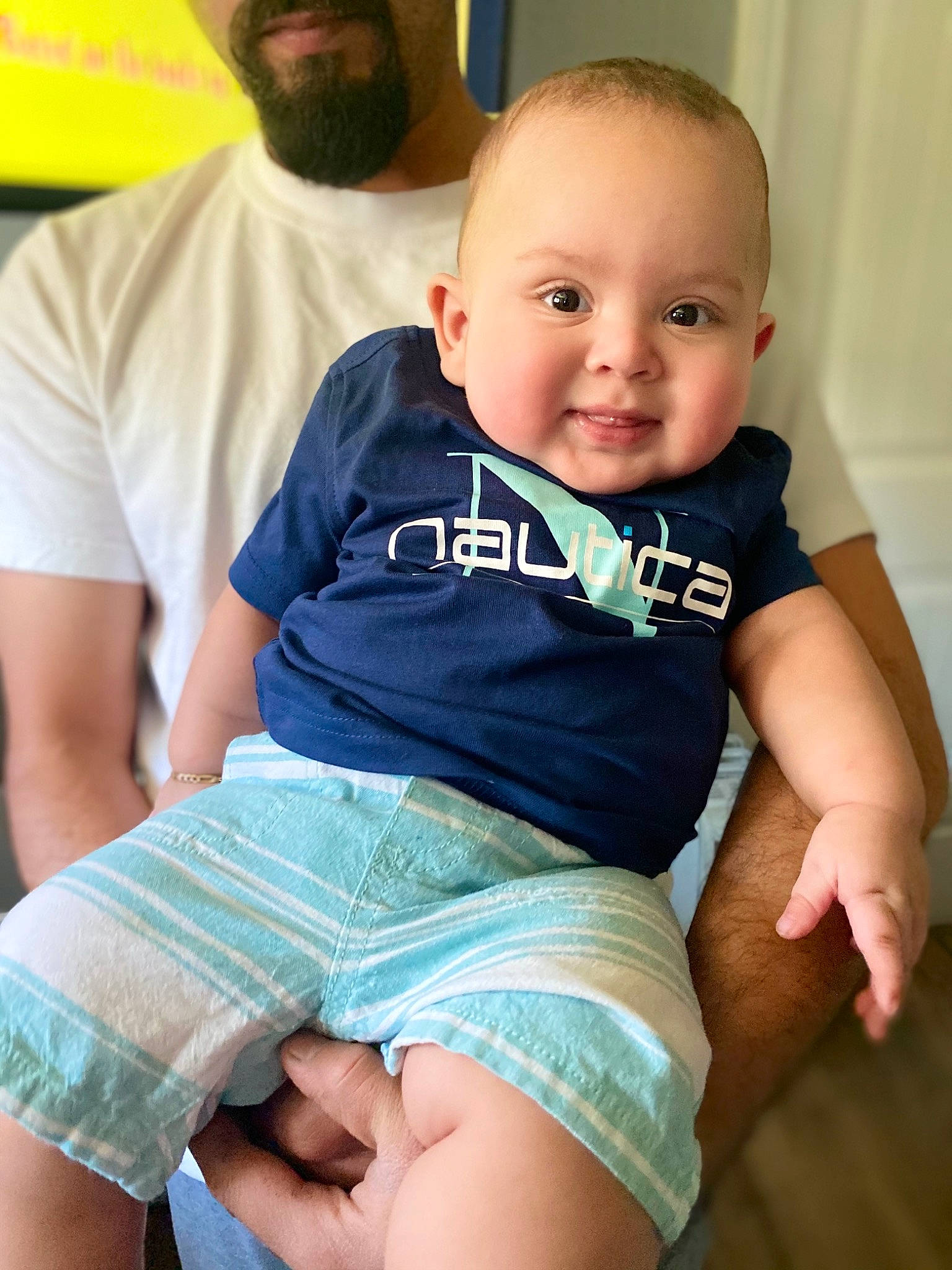 Adan is registered to the contest to win money with this photo: arm, baby_toddler_clothing, beard, chest, child, happy, jean_short, joint, joy, leg, muscle, organ, people, person, shorts, shoulder, skin, t_shirt, thigh, toddler