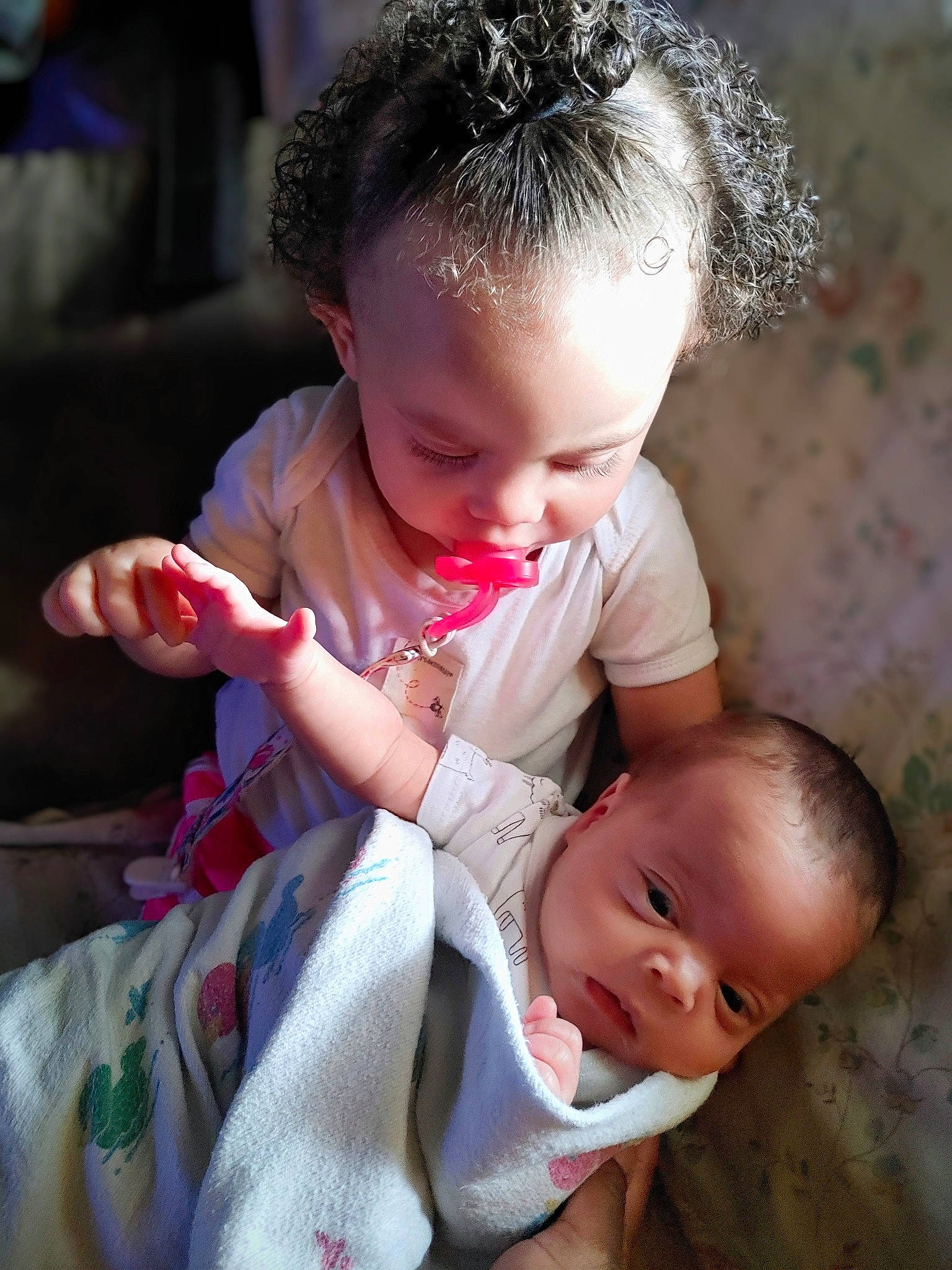 Sariyah joined the competition — help win amazing prizes! baby, baby_toddler_clothing, cheek, child, dress, ear, event, finger, flash_photography, fun, gesture, hairstyle, hand, happy, human_body, lip, nail, person, sitting, skin