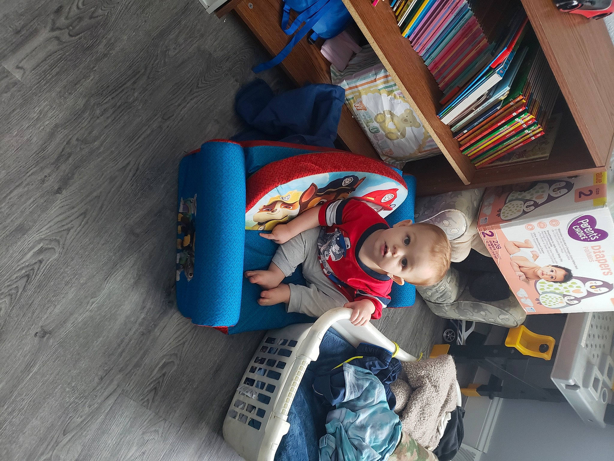 Braydin joined the competition — help win amazing prizes! baby, baby_products, baby_toddler_clothing, baby_toys, book, comfort, floor, flooring, lap, nap, person, publication, toddler, wood_flooring