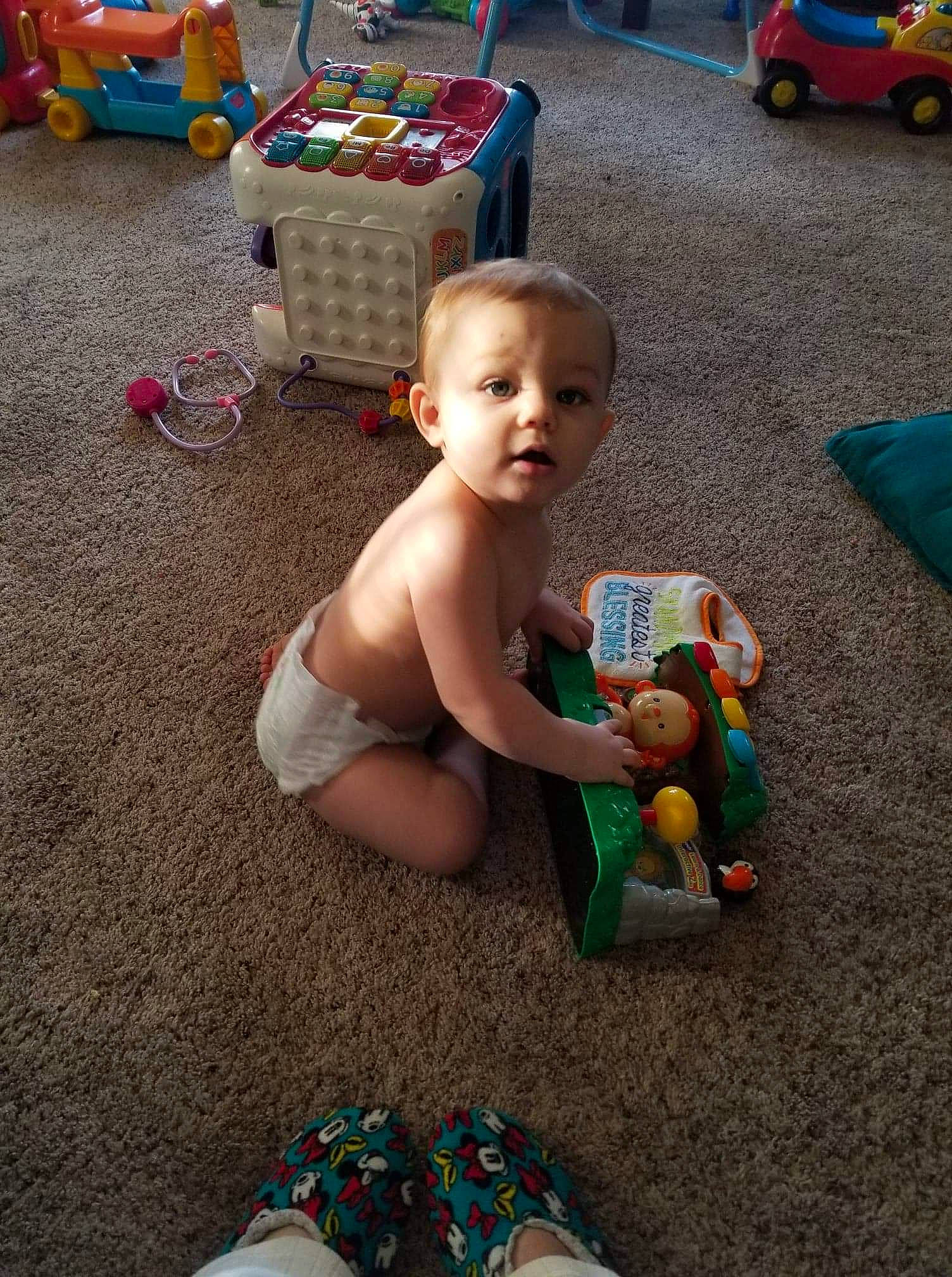 Braydin joined the competition — help win amazing prizes! abdomen, ankle, baby, baby_products, baby_toys, barechested, box, child, cross_training_shoe, doll, foot, outdoor_shoe, person, plastic, play, slipper, sock, surprise, toe, toy
