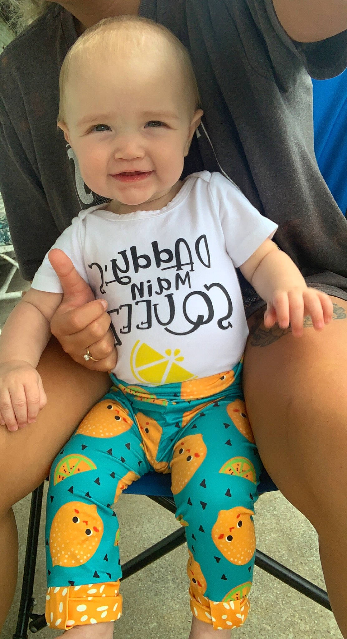 Cambrie joined the competition — help win amazing prizes! arm, baby_toddler_clothing, eye, face, happy, head, joint, joy, knee, leg, muscle, neck, orange, organ, person, skin, sleeve, smile, stomach, textile