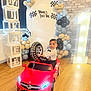 Mikael joined the competition — help win amazing prizes! toddler, child, toy_car, red_car, indoor, birthday_party, balloons, decorations, number_one, celebration, wooden_floor, brick_wall, smiling, boy, formal_clothing, bow_tie, steering_wheel, party, event, happy