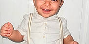 Mikael joined the competition — help win amazing prizes! toddler, child, smiling, happy, white_clothing, suspenders, standing, indoor, portrait, cute, young_child, face, hands, buttoned_shirt, short_sleeves, pants, fashion, person, closeup, background