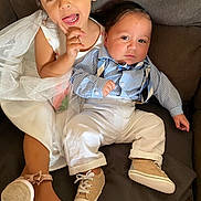 Hugo Rodriguez is registered to the contest to win money with this photo: baby, child, clothing, couch, cute, dress, family, fashion, footwear, happy, indoor, person, portrait, pose, shirt, shoes, siblings, smile, suspenders, toddler