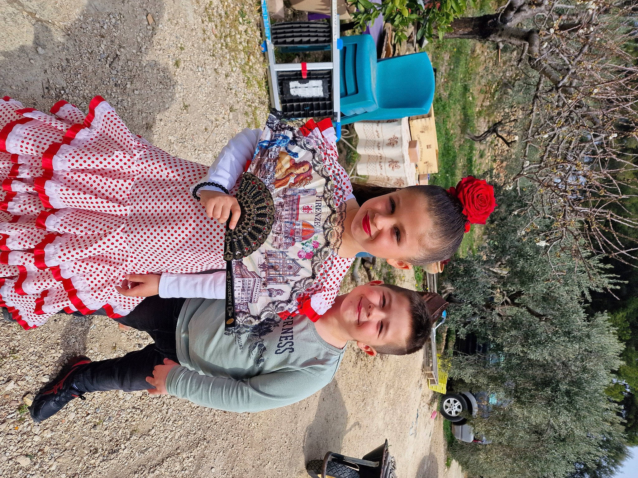 Cchiara participe au concours pour gagner de l'argent avec cette photo : child, conifer, design, fun, grass, green, joy, leisure, pattern, pedestrian, person, plant, sandal, shrub, sitting, street, toddler, tourism, travel, tree