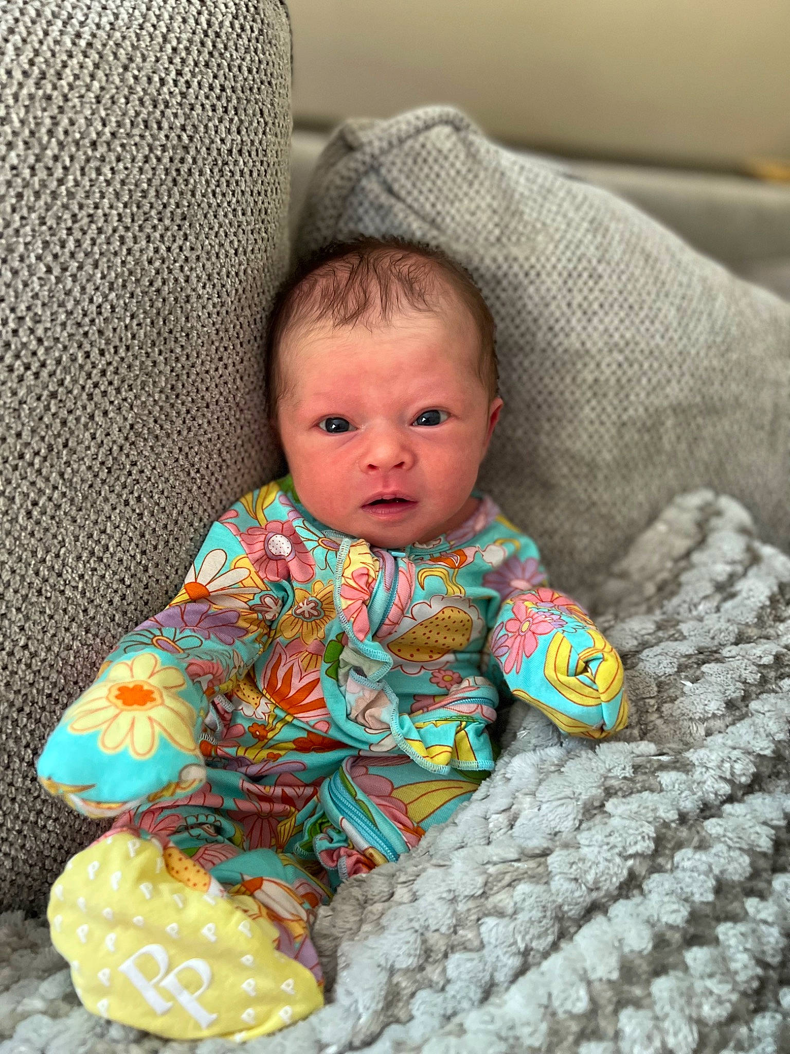 Blakely is registered to the contest to win money with this photo: baby, baby_toddler_clothing, bedding, chair, cheek, child, comfort, eye, face, flooring, head, iris, linens, pattern, person, product, room, sitting, skin, textile