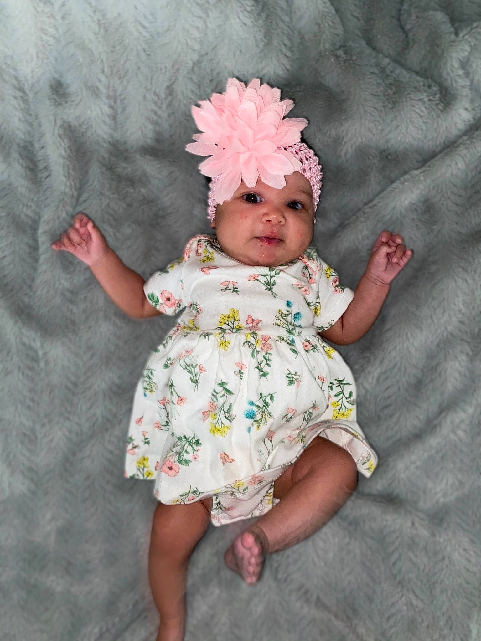 Ariya joined the competition — help win amazing prizes! baby, baby_toddler_clothing, child, costume_hat, day_dress, dress, face, happy, head, headpiece, headwear, linens, magenta, one_piece_garment, pattern, person, petal, pink, purple, sleeve