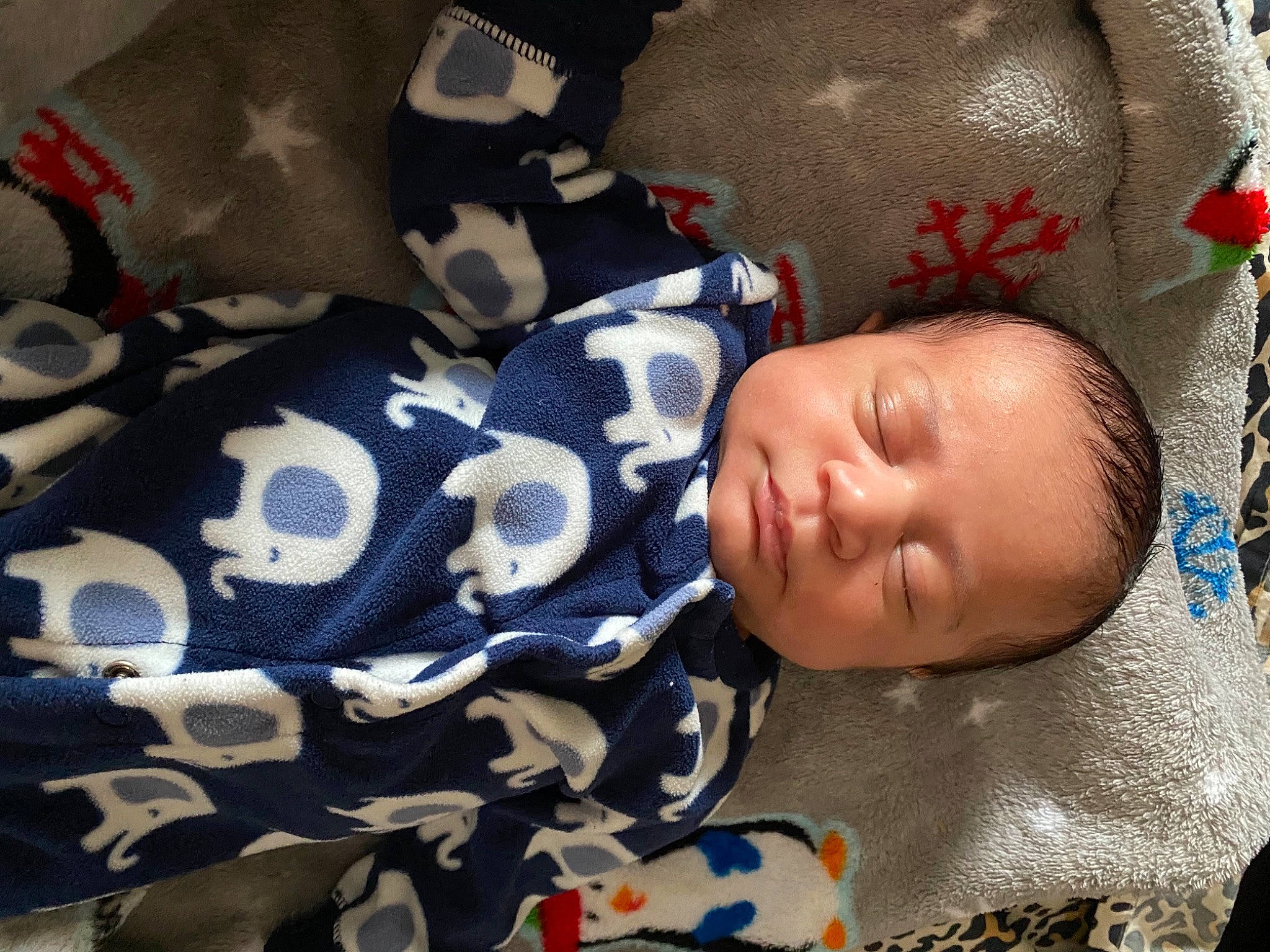 Savon is registered to the contest to win money with this photo: baby, baby_products, baby_sleeping, baby_toddler_clothing, bedtime, camouflage, comfort, linens, military_camouflage, nap, person, sleep