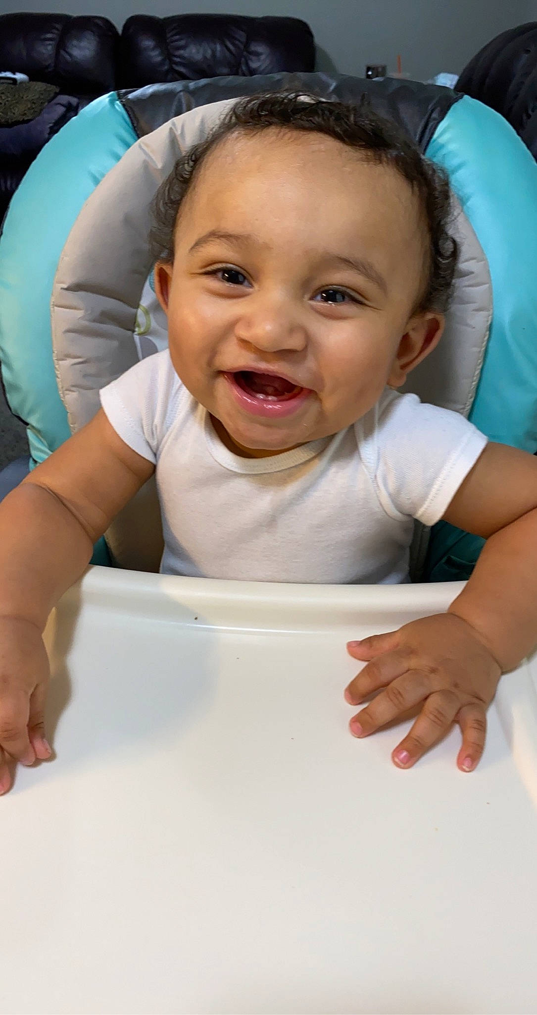 Tayshaun is registered to the contest to win money with this photo: baby, baby_laughing, baby_products, baby_toddler_clothing, child, ear, eye, finger, hand, inflatable, laugh, mouth, nail, nose, person, skin, toddler, tongue, tooth