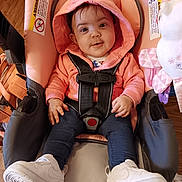 Aidalenyz joined the competition — help win amazing prizes! baby, car_seat, casual, child, clothing, cute, flooring, happy, hoodie, indoor, infant, person, pink, portrait, seat, smiling, straps, toy, white_sneakers, young_child