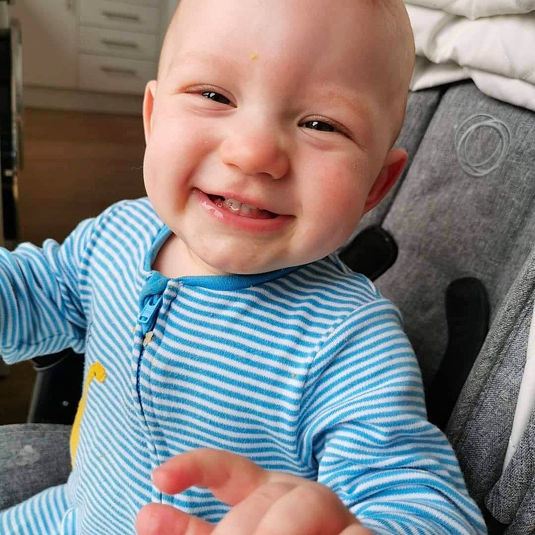 Bertie is registered to the contest to win money with this photo: baby, cheek, child, chin, cool, eye, face, facial_expression, finger, happy, head, joy, laugh, lip, mouth, nose, organ, person, skin, smile