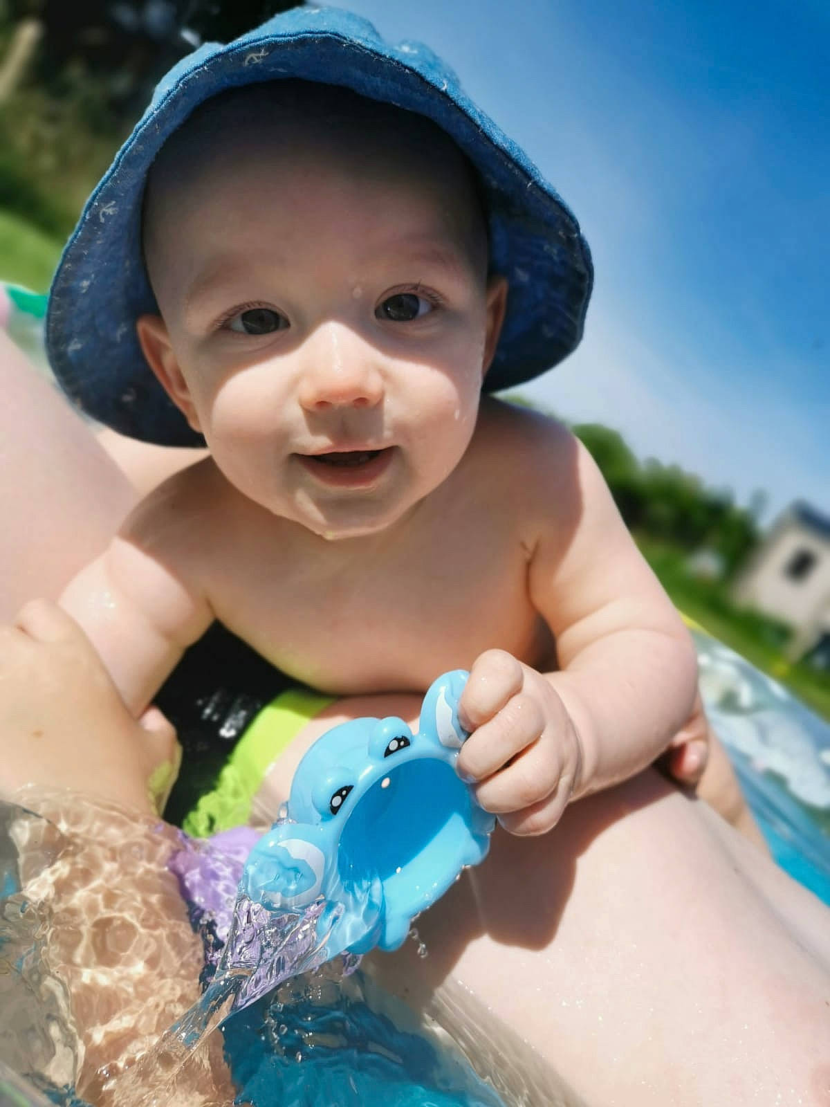 Bertie joined the competition — help win amazing prizes! baby, black_hair, cap, child, cool, fun, hand, happy, headgear, leisure, person, play, recreation, skin, smile, summer, toddler, vacation, water