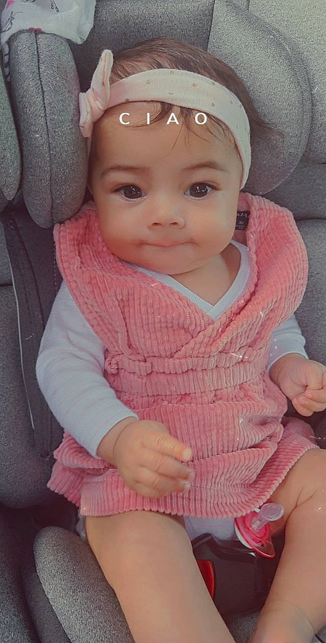 Shayna participe au concours pour gagner de l'argent avec cette photo : baby, car_seat, cheek, child, face, finger, headgear, headwear, knitting, lip, person, pink, skin, toddler