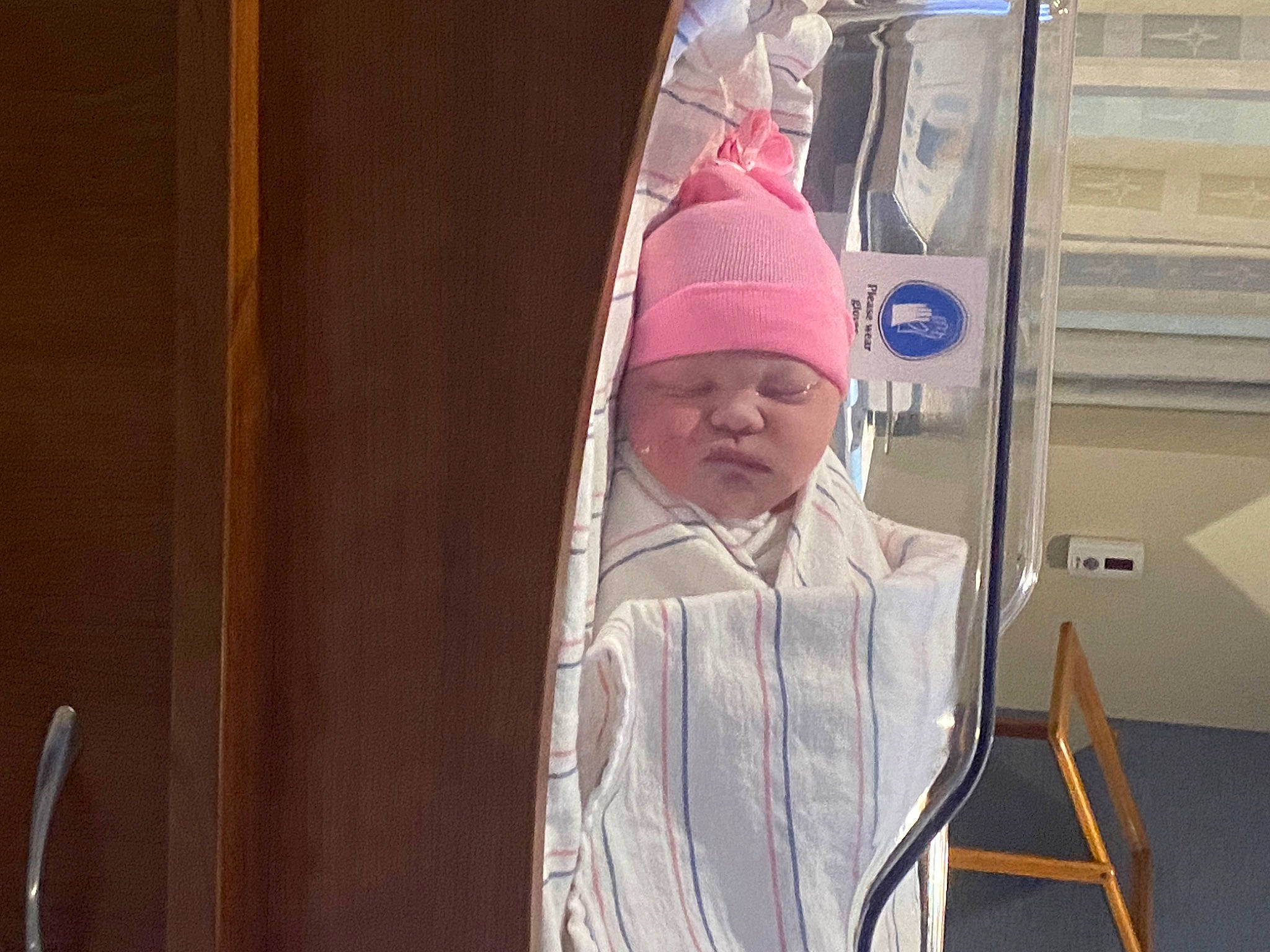 Ellie is registered to the contest to win money with this photo: art, baby, cap, child, cope, fun, glass, headgear, headwear, hoodie, leisure, magenta, person, room, toddler, vacation, visual_arts, window, wood