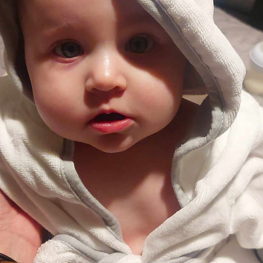 Adiley joined the competition — help win amazing prizes! baby, bath_time, child, chubby_cheeks, closeup, curious, cute, expression, face, headwear, hooded_towel, indoors, infant, looking_at_camera, person, portrait, skin, soft_lighting, white_towel, wrapped