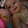 baby, headband, bow, smiling, face, child, toy, seat, colorful, heart, sparkle, infant, cute, clothing, closeup, indoors, happy, skin, person, playful