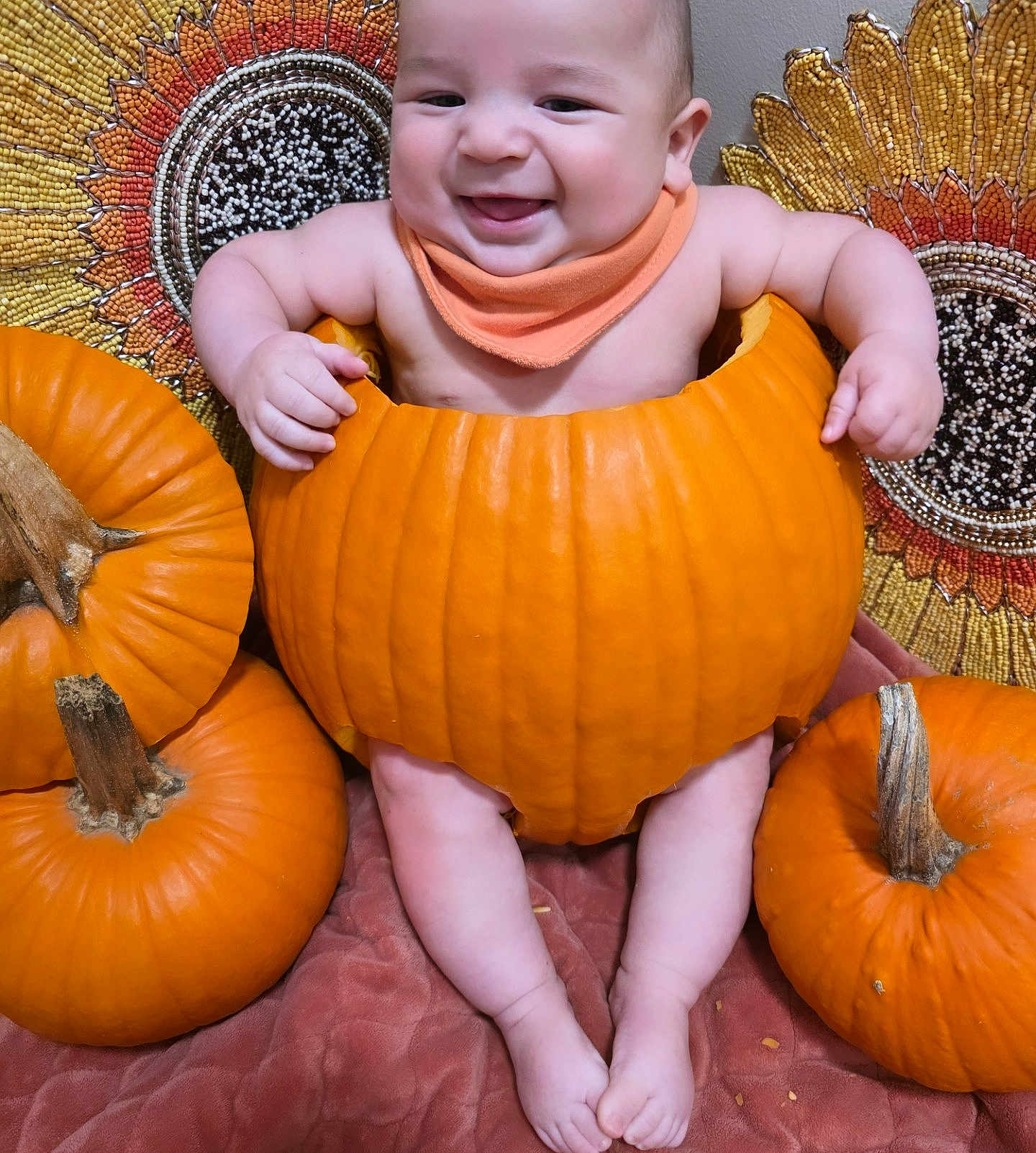 Marcello joined the competition — help win amazing prizes! baby, pumpkin, smiling, orange, cute, autumn, fall, holiday, child, seasonal, decor, sitting, face, feet, blanket, background, happy, festive, headwear, indoors