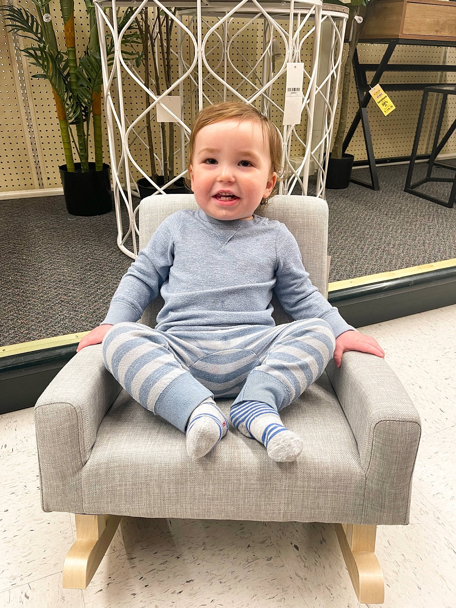 Blake is registered to the contest to win money with this photo: baby, baby_toddler_clothing, chair, child, comfort, flooring, flowerpot, grass, happy, houseplant, leisure, person, plant, portrait_photography, sitting, sleeve, smile, t_shirt, toddler, white
