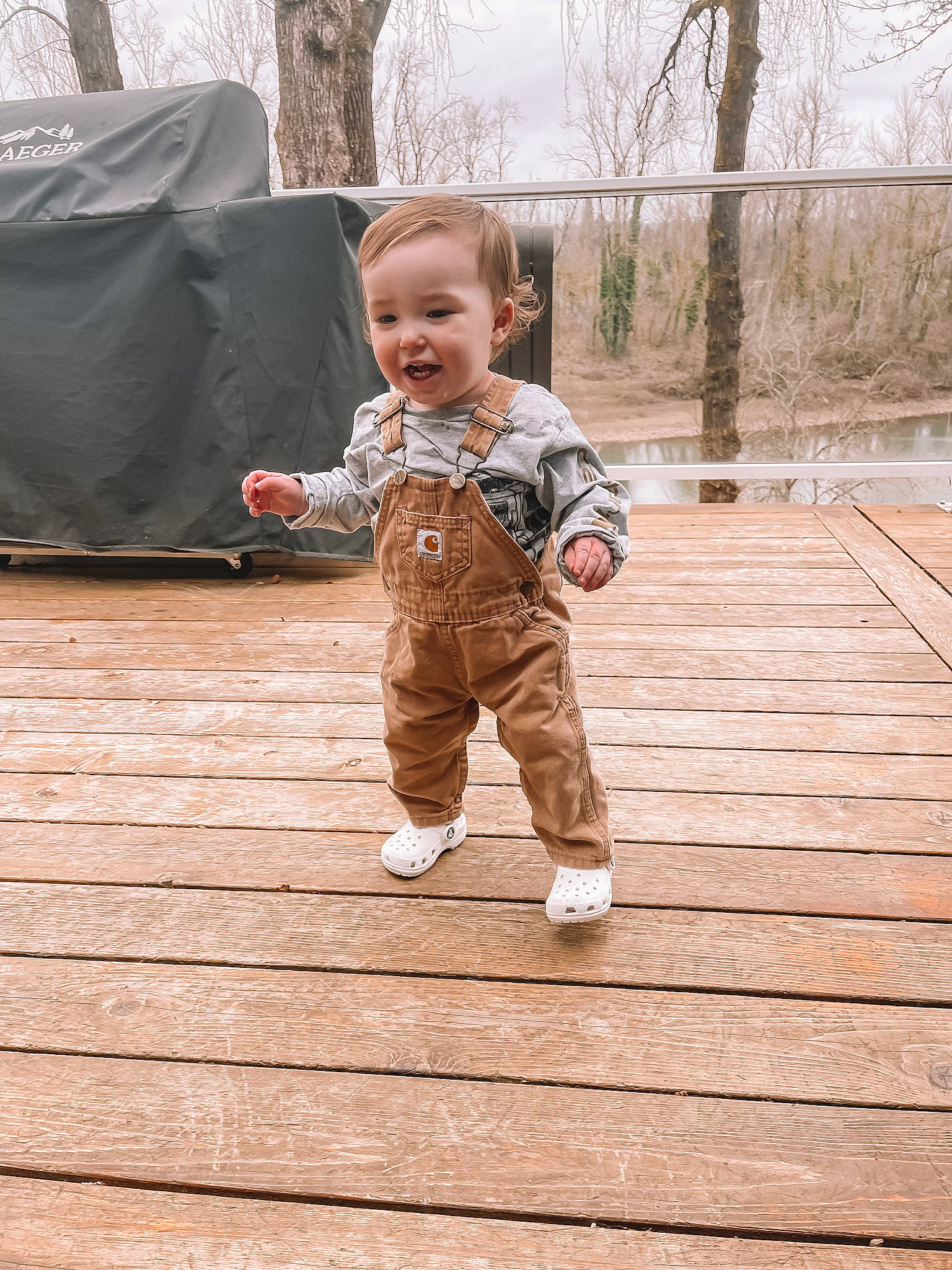 Blake joined the competition — help win amazing prizes! baby, baby_toddler_clothing, deck, floor, flooring, fun, grass, happy, hardwood, leisure, people_in_nature, person, plank, sitting, skin, smile, toddler, tree, wood, wood_flooring