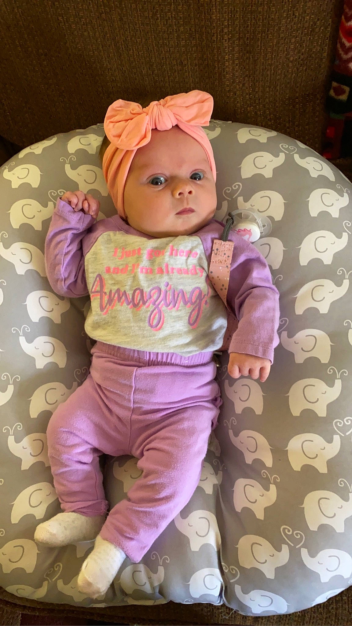 Aubrey is registered to the contest to win money with this photo: arm, baby, baby_toddler_clothing, cheek, child, doll, eye, eyelash, hat, head, headgear, headwear, magenta, person, pink, product, skin, sleeve, textile, toddler