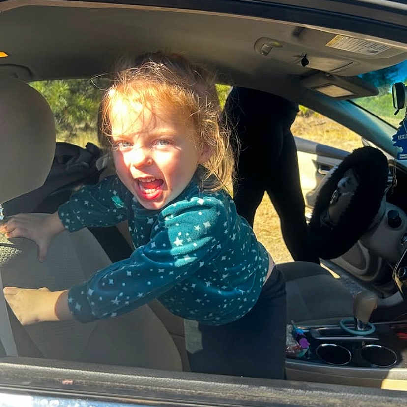 Olivia joined the competition — help win amazing prizes! adult, angry, baby, car, crying, cushion, face, female, head, homedecor, person, photography, portrait, sad, shouting, suv, transportation, vehicle, woman, yawning