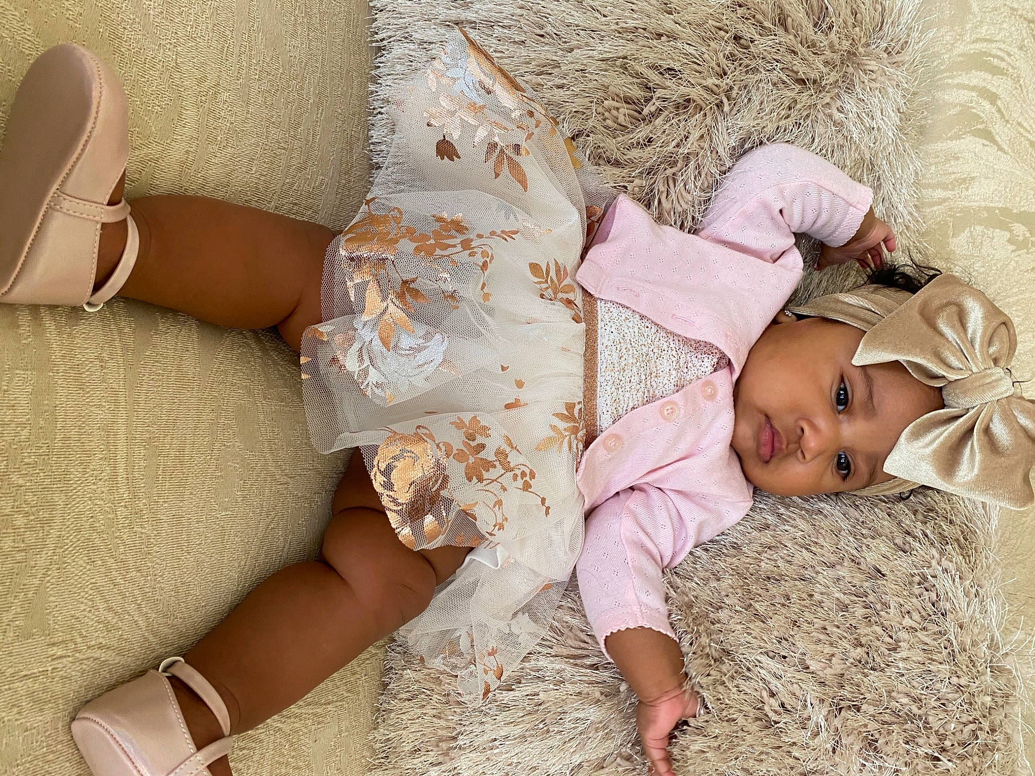 Emani joined the competition — help win amazing prizes! ankle, baby, baby_toddler_clothing, beige, bridal_shoe, comfort, day_dress, embellishment, foot, hay, headwear, lace, nose, peach, person, pink, sandal, shoe, straw, tan