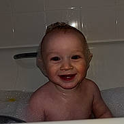 Elijah is registered to the contest to win money with this photo: baby, toddler, bath, bathtub, bubbles, foam, smile, happy, child, water, skin, face, head, indoor, tile, cute, fun, playful, young, person