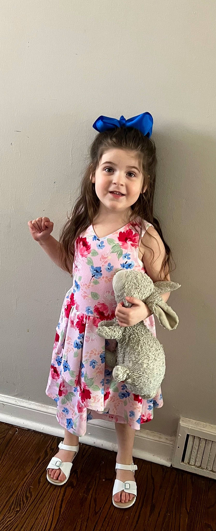 Isabelle is registered to the contest to win money with this photo: arm, baby_toddler_clothing, blue, dress, finger, hair, happy, joy, neck, outerwear, person, pink, purple, shoulder, skin, sleeve, smile, standing, t_shirt, textile