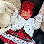 Aurora is registered to the contest to win money with this photo: baby, sleeping, red_bow, headband, white_mittens, plaid_dress, lace, knitted_cardigan, soft_blanket, plush_toy, cozy, holiday, infant, cute, peaceful, portrait, clothing, indoors, child, newborn