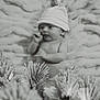 Eric joined the competition — help win amazing prizes! baby, infant, hat, striped_hat, blanket, pine_branches, winter_theme, black_and_white, soft_texture, lying_down, newborn, cute, cozy, nature_elements, closeup, portrait, indoors, small, peaceful, holiday