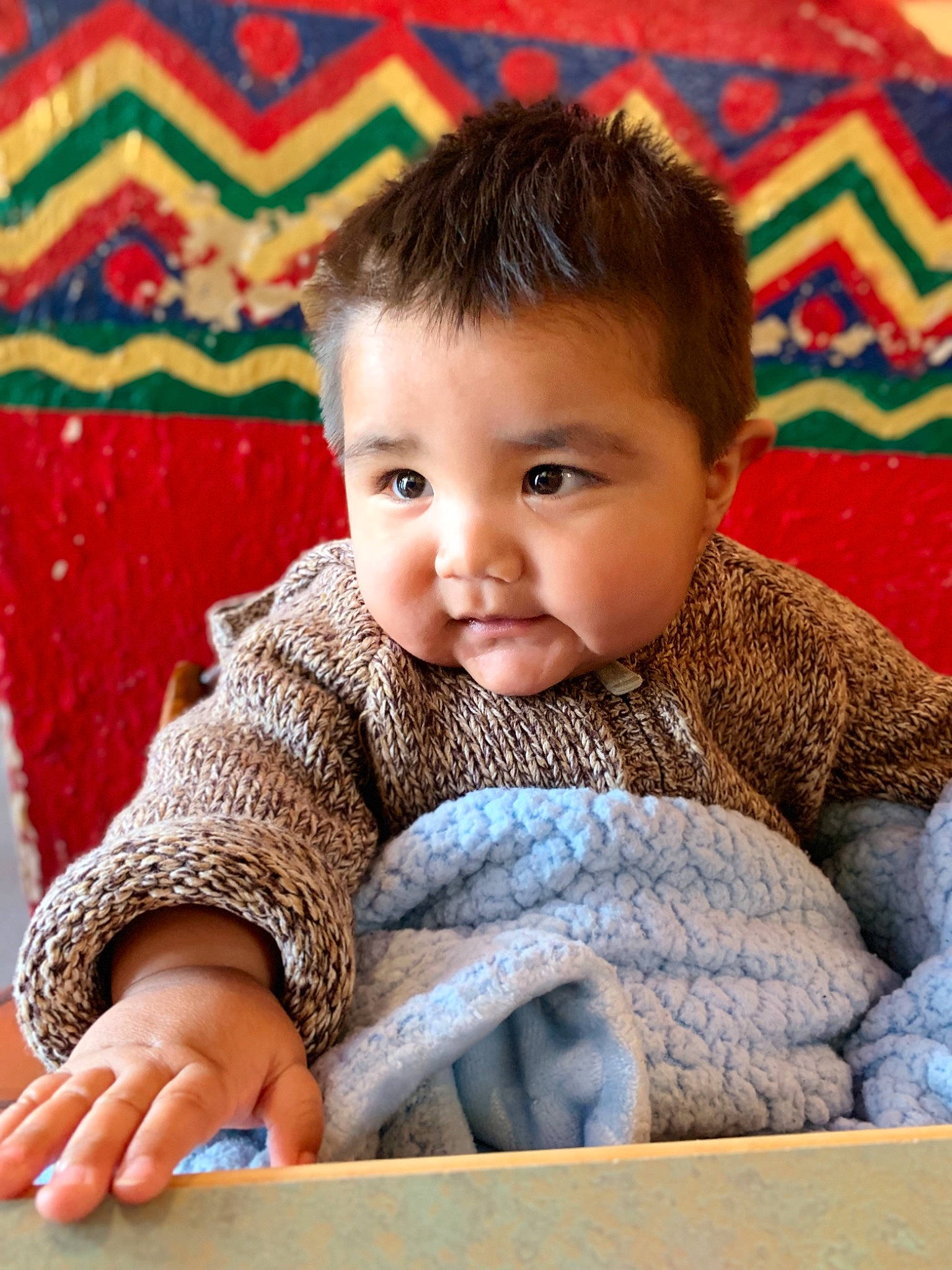 Luis joined the competition — help win amazing prizes! baby, cheek, child, face, knitting, person, portrait_photography, sitting, skin, smile, toddler, wool