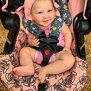 Avery is registered to the contest to win money with this photo: baby, bonnet, cap, car, clothing, coat, costume, face, happy, hat, head, hood, jacket, person, photography, portrait, skin, smile, stroller, tattoo