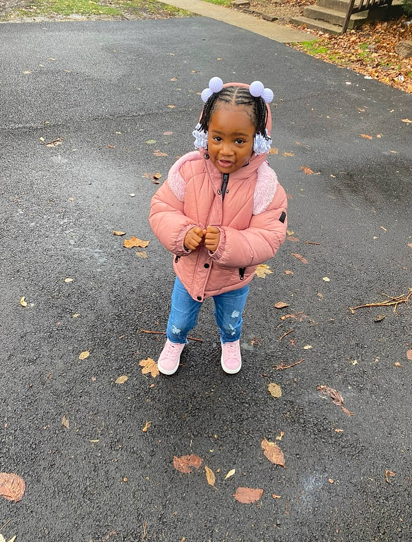 Taylor is registered to the contest to win money with this photo: asphalt, child, fun, gesture, grass, happy, hat, joy, landscape, leaf, leg, leisure, people_in_nature, person, public_space, recreation, road, road_surface, sidewalk, soil