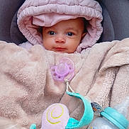 Mélodie participe au concours pour gagner de l'argent avec cette photo : baby, pacifier, blanket, hood, bottle, infant, cute, cozy, pink, soft, toy, child, portrait, indoors, warm, newborn, face, clothing, rest, comfort