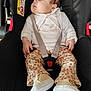 Zaÿna participe au concours pour gagner de l'argent avec cette photo : baby, sleeping, car_seat, child, infant, seatbelt, clothing, pants, shoes, cute, peaceful, face, hand, straps, black, fabric, indoor, safety, rest, young