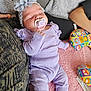 Zaÿna a rejoint le concours — aidez-le/la à gagner de superbes lots ! baby, sleeping, pacifier, headband, flower, purple_clothing, blanket, cushion, indoor, child, infant, soft_texture, resting, cute, comfort, person, toddler, nap, cozy, relaxation