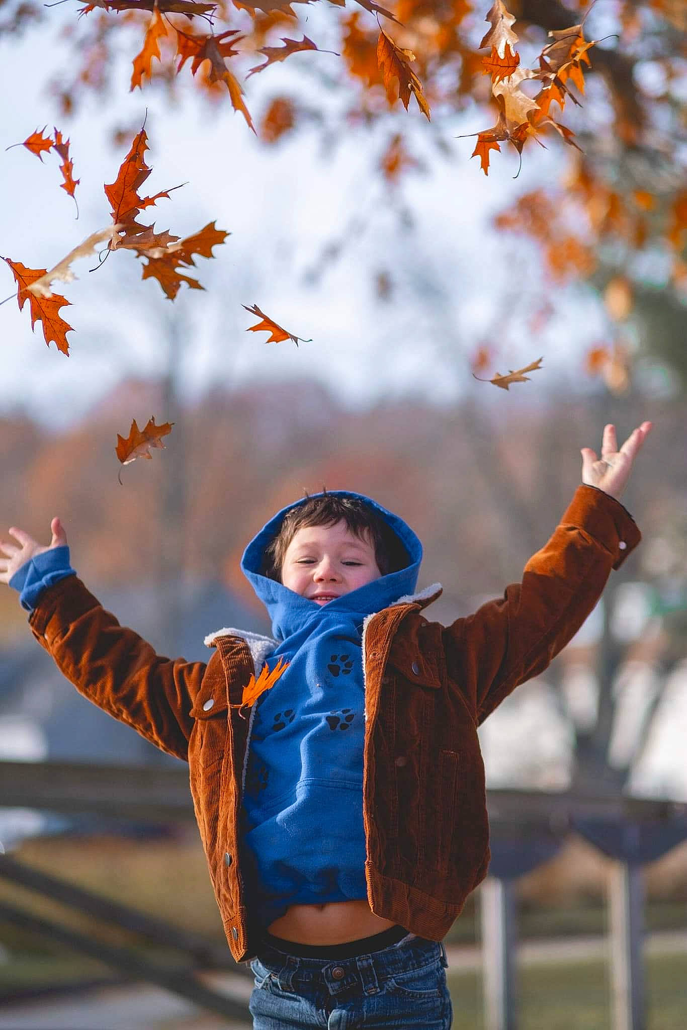 Nikolai joined the competition — help win amazing prizes! arm, branch, clothing, daytime, gesture, glove, happy, head, jacket, jeans, leaf, morning, orange, outerwear, people, people_in_nature, person, red, smile, sunlight