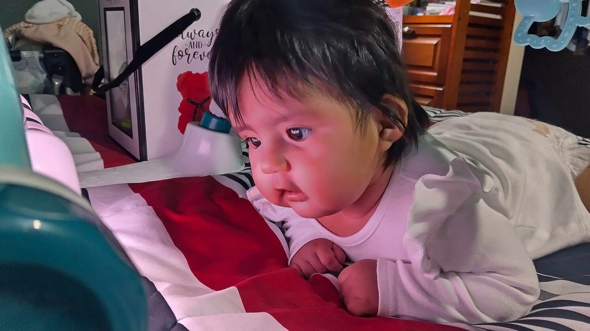 Eliette Orihuela is registered to the contest to win money with this photo: baby, infant, child, bed, blanket, curious, face, furniture, indoors, laying_down, person, portrait, soft_lighting, white_clothing, chubby_cheeks, hand, hair, room, sleepwear, table