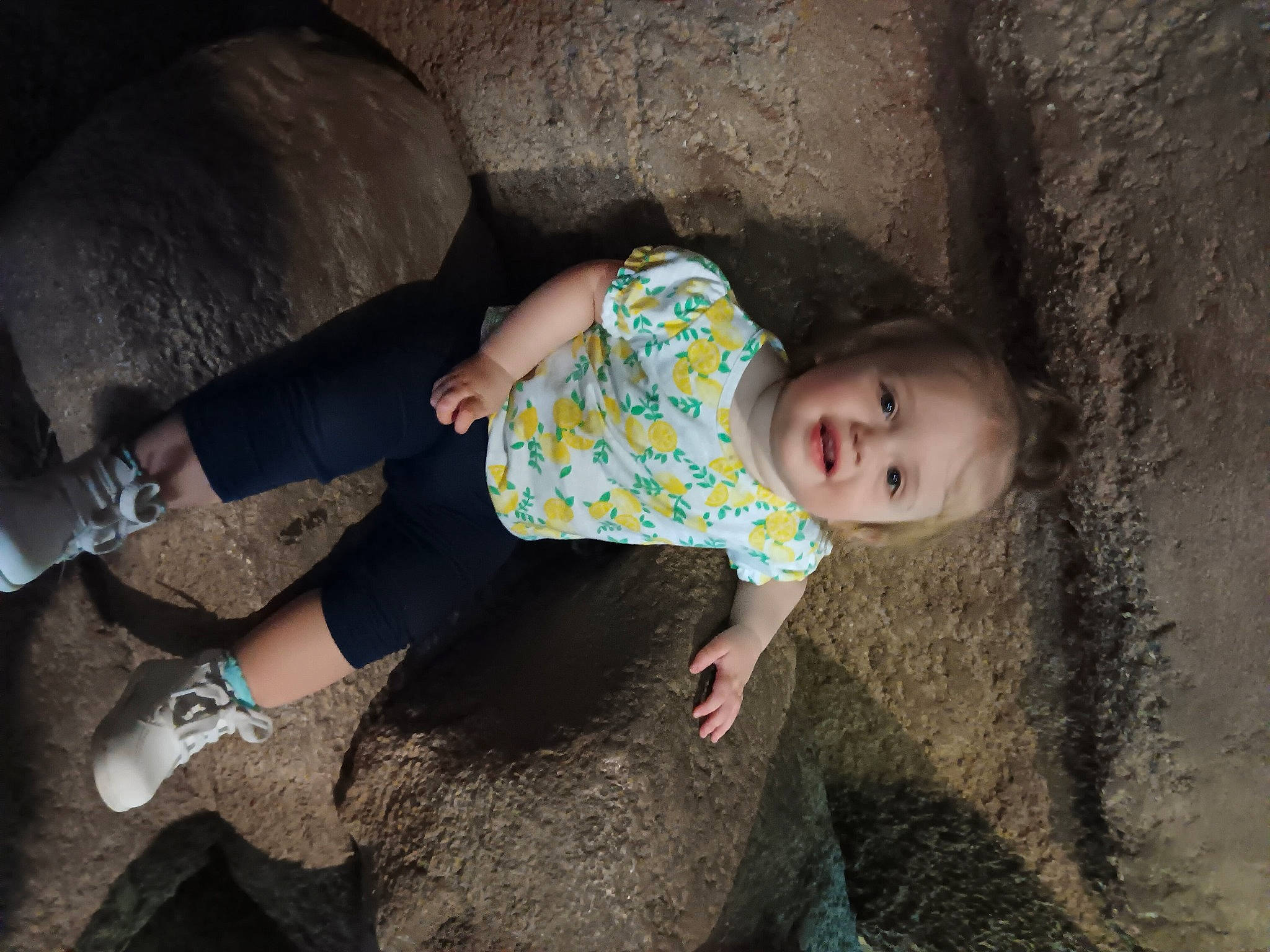 Addison joined the competition — help win amazing prizes! baby, comfort, flash_photography, fun, grass, head, human, human_body, human_leg, knee, leg, person, recreation, rock, sitting, skin, sock, soil, thigh, toddler