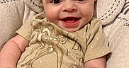 Isabella is registered to the contest to win money with this photo: baby, smiling, infant, clothing, deer, chipmunk, blanket, cushion, seated, happy, cute, portrait, indoors, child, person, soft, fabric, hand, face, eyes