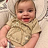 baby, smiling, infant, clothing, deer, chipmunk, blanket, cushion, seated, happy, cute, portrait, indoors, child, person, soft, fabric, hand, face, eyes