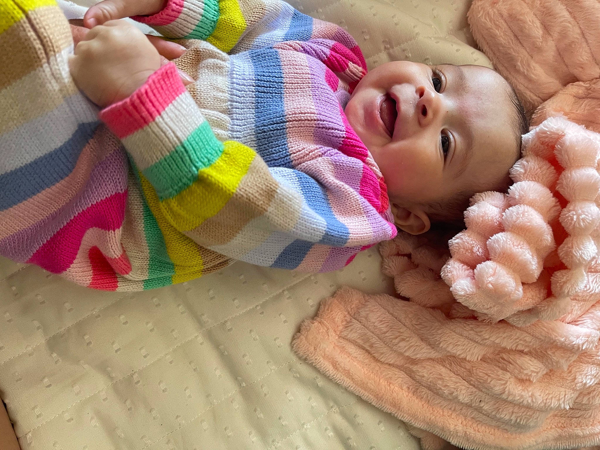 Aryah is registered to the contest to win money with this photo: arm, baby, baby_toddler_clothing, cheek, comfort, eye, face, finger, hand, happy, head, lip, nail, person, pink, product, skin, smile, textile, thumb