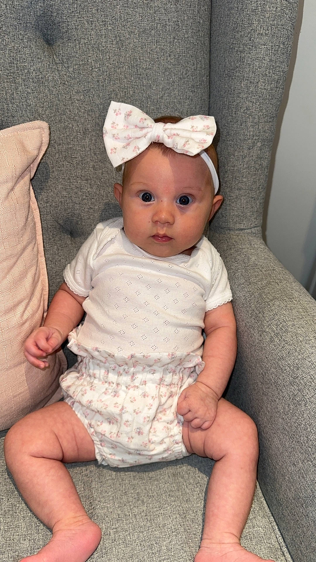 Avery is registered to the contest to win money with this photo: accessories, baby, chair, clothing, couch, cushion, dress, face, furniture, hat, head, homedecor, newborn, pants, person, photography, portrait, shorts, sitting, toy
