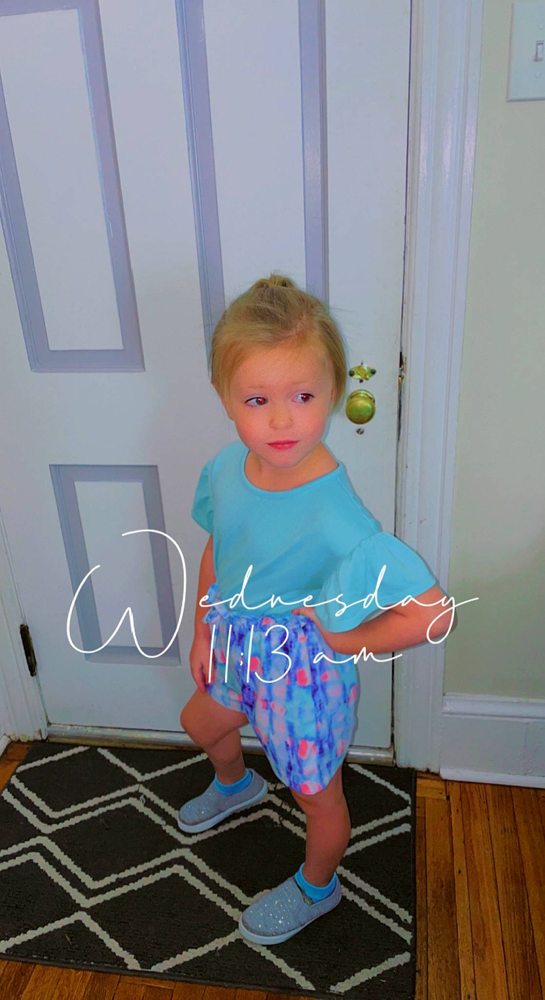 Addison is registered to the contest to win money with this photo: baby_toddler_clothing, child, day_dress, electric_blue, fashion_design, floor, flooring, fun, human_leg, knee, leg, one_piece_garment, pattern, person, pink, sleeve, standing, t_shirt, toddler, waist
