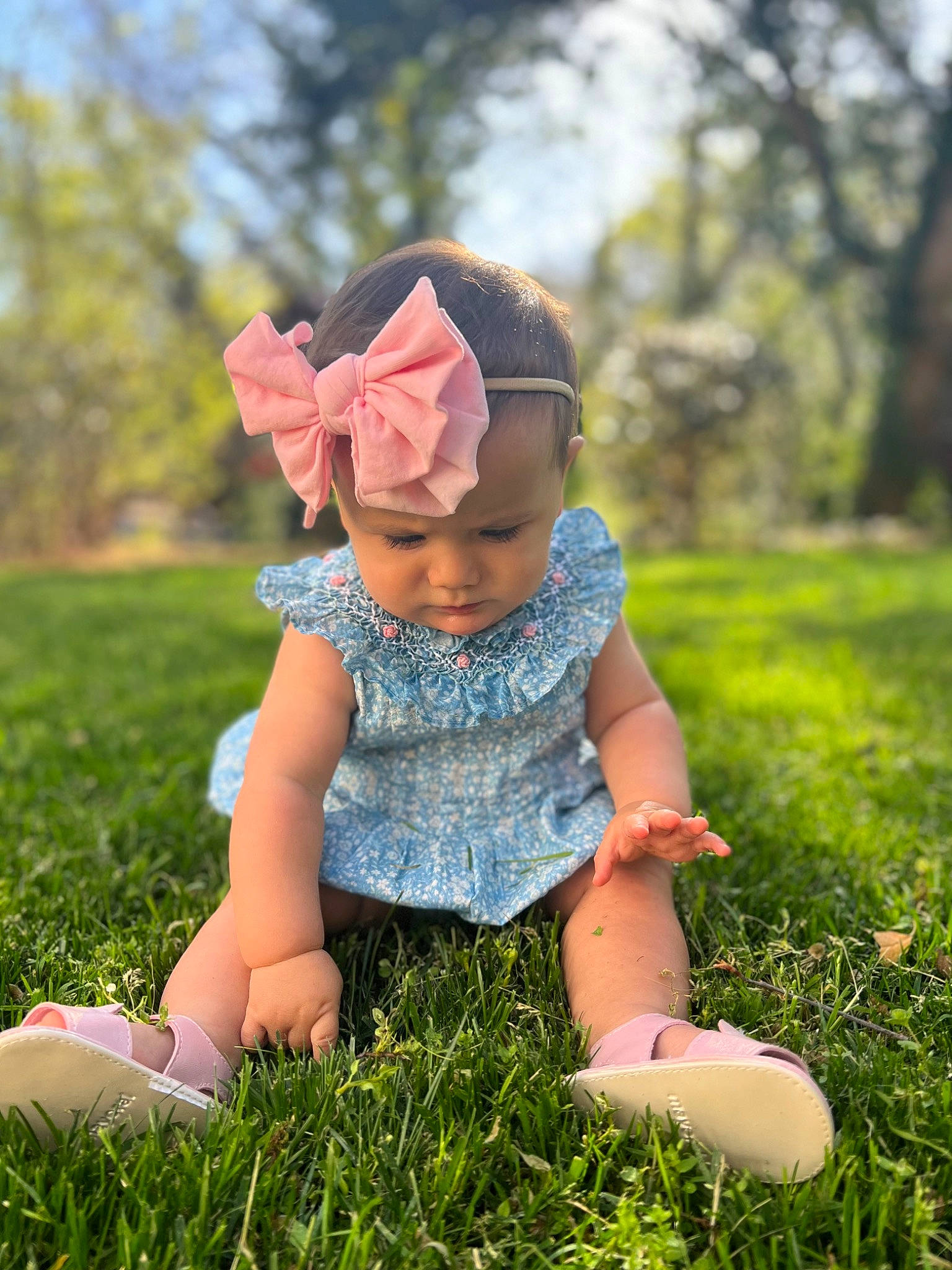 Paloma is registered to the contest to win money with this photo: baby, baby_toddler_clothing, cap, dress, flash_photography, grass, grassland, green, happy, headwear, leaf, meadow, people_in_nature, person, pink, plant, shoe, skin, summer, sunlight