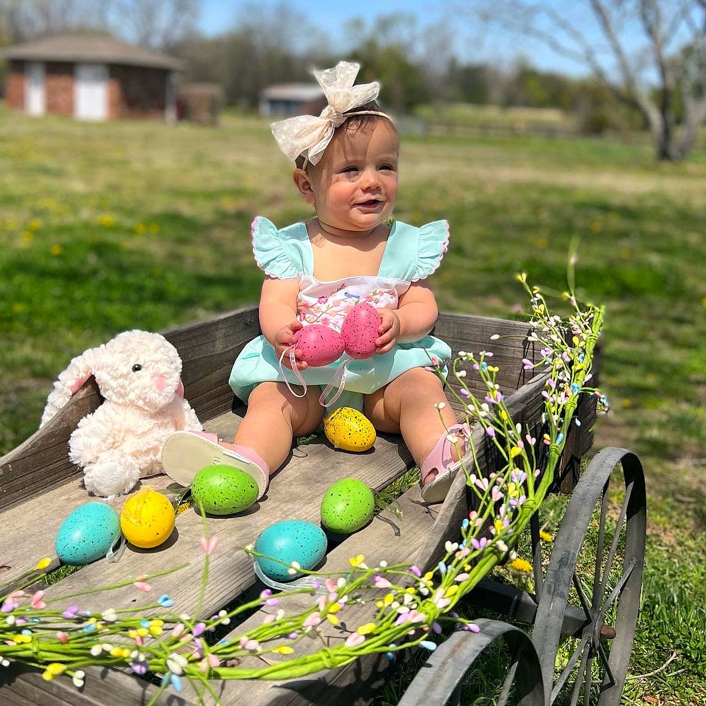 Paloma is registered to the contest to win money with this photo: baby_toddler_clothing, child, easter, event, fawn, fun, grass, grassland, happy, hat, leisure, people_in_nature, person, photograph, plant, recreation, sky, tire, toddler, toy