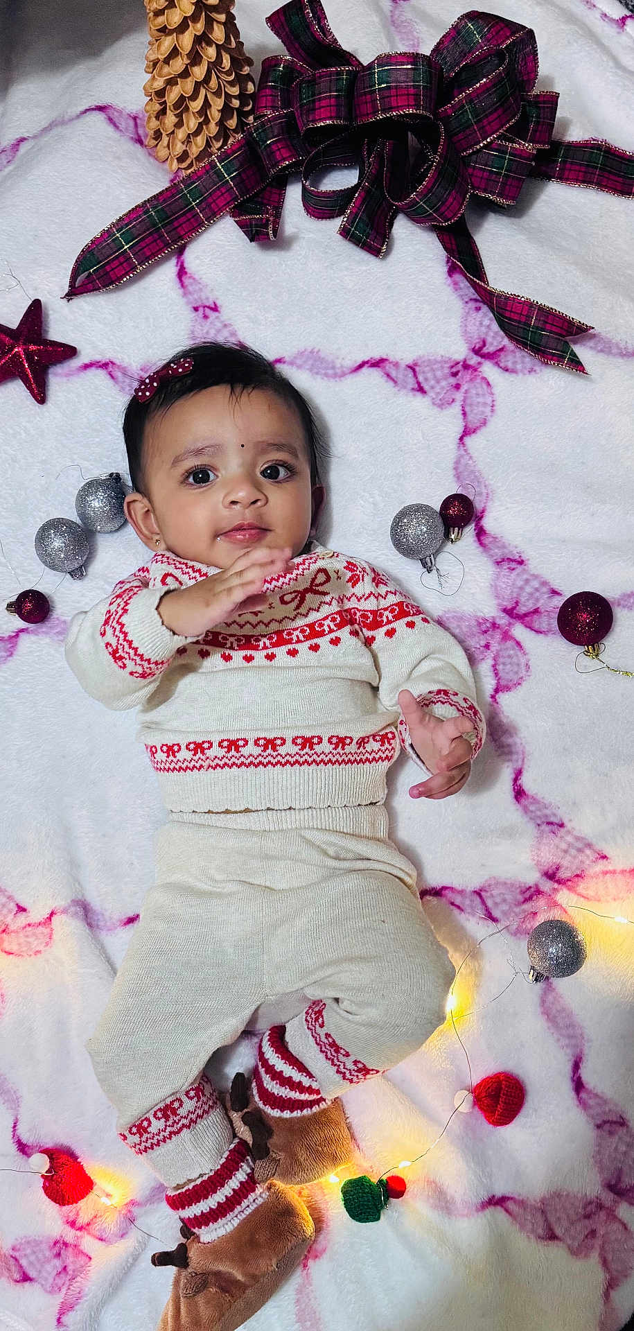 Issa joined the competition — help win amazing prizes! baby, infant, child, knitwear, holiday, christmas, ornaments, lights, blanket, cute, smiling, face, toy, decorations, red, white, brown, plush, socks, cozy