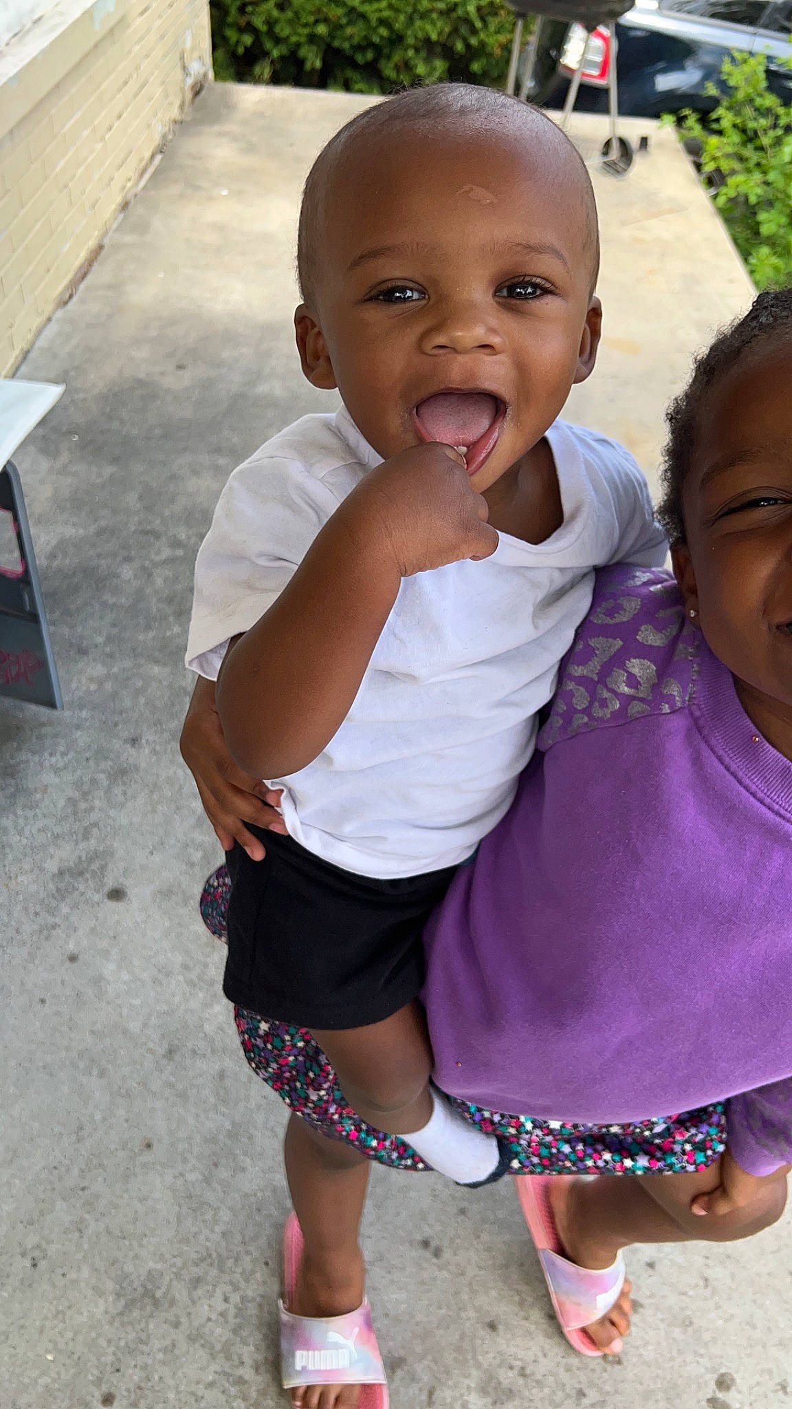 Bentley joined the competition — help win amazing prizes! baby, baby_toddler_clothing, black, child, face, fun, gesture, grass, happy, head, iris, leg, lip, person, pink, sandal, skin, smile, t_shirt, thumb