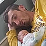 Leah Paige Henry joined the competition — help win amazing prizes! man, baby, sleeping, couch, blanket, yellow_shirt, indoor, resting, peaceful, family, nap, closeup, head, person, comfort, relaxation, parent, child, cozy, bonding